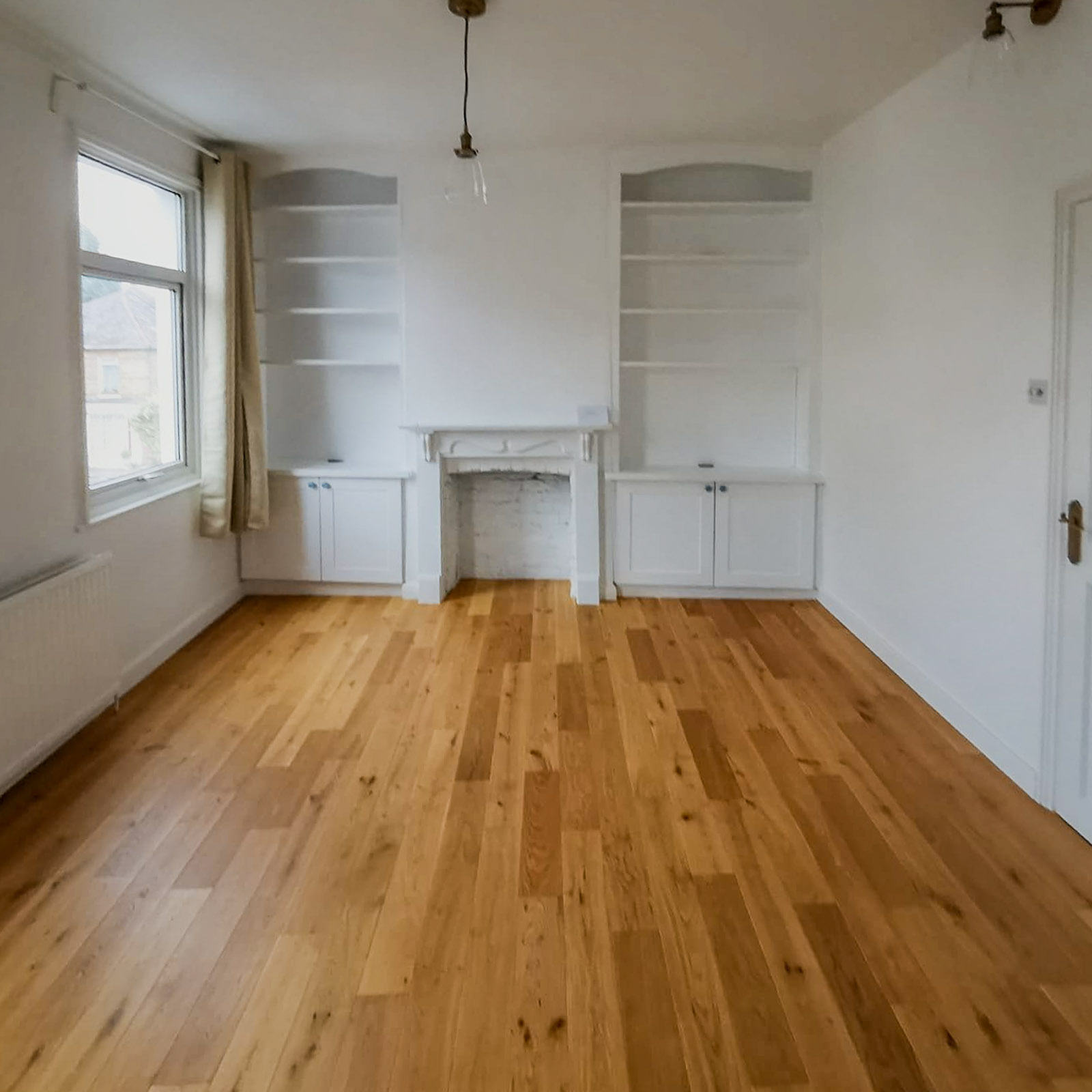 Renovated living room with new flooring and decoration, Lordship Lane