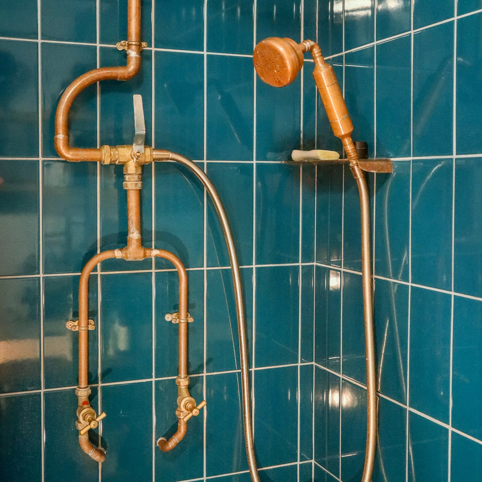 Custom bathroom with bespoke tiling and copper welded pipework, Paddock Close