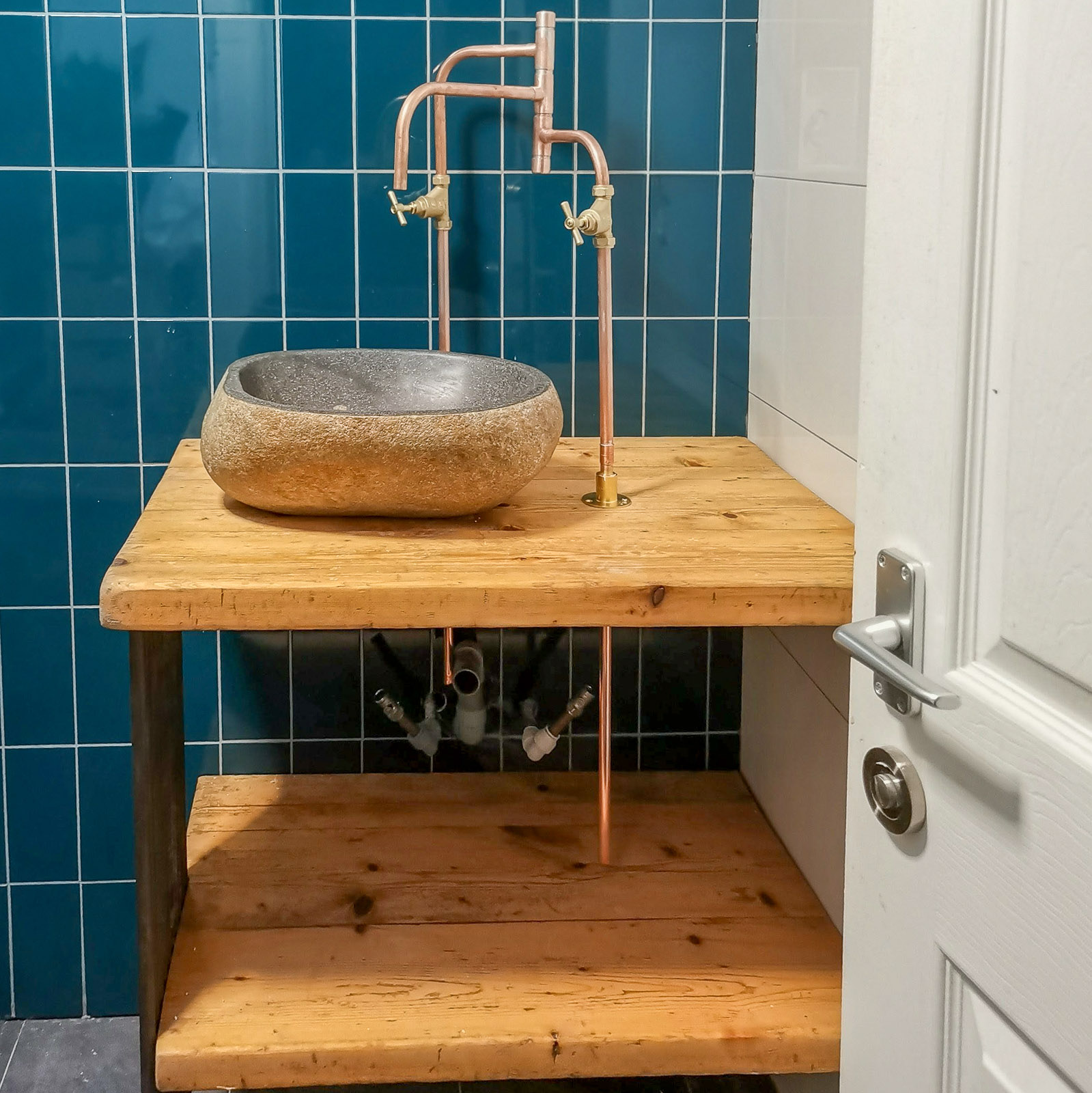 Bespoke tiling and copper pipework bathroom detail, Paddock Close