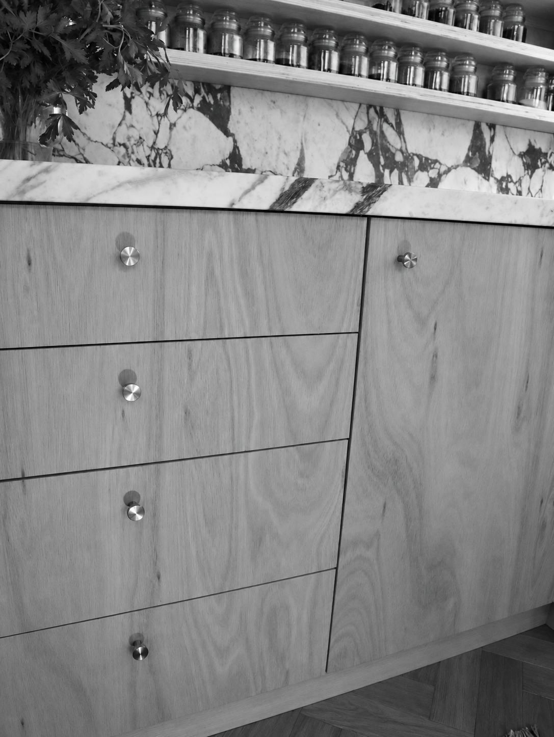 Monochrome bespoke kitchen cabinetry and marble detail